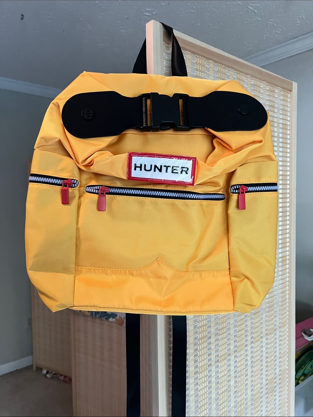 Hunter Yellow Backpack with Black Straps and Red Accents